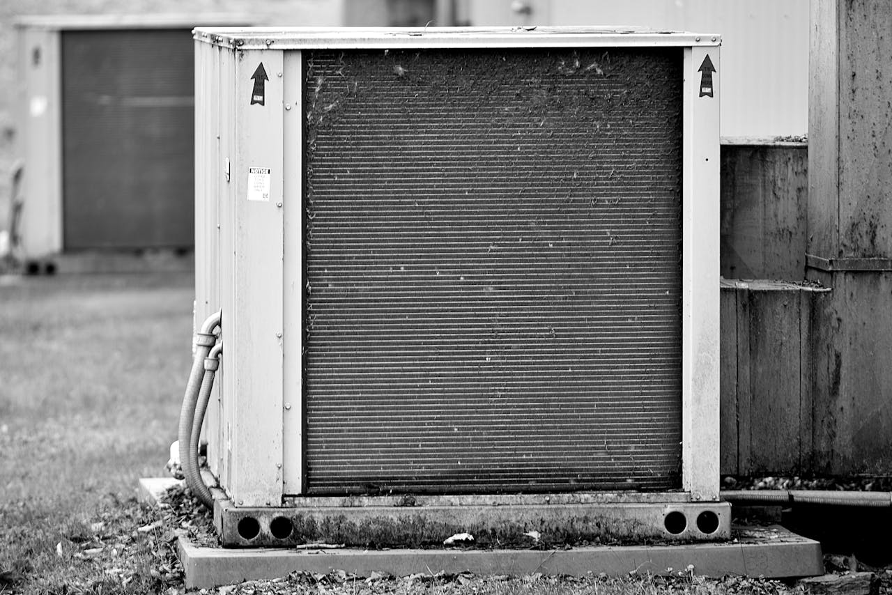 services-01 Close-up of an industrial HVAC unit outdoors, showcasing its metal texture.